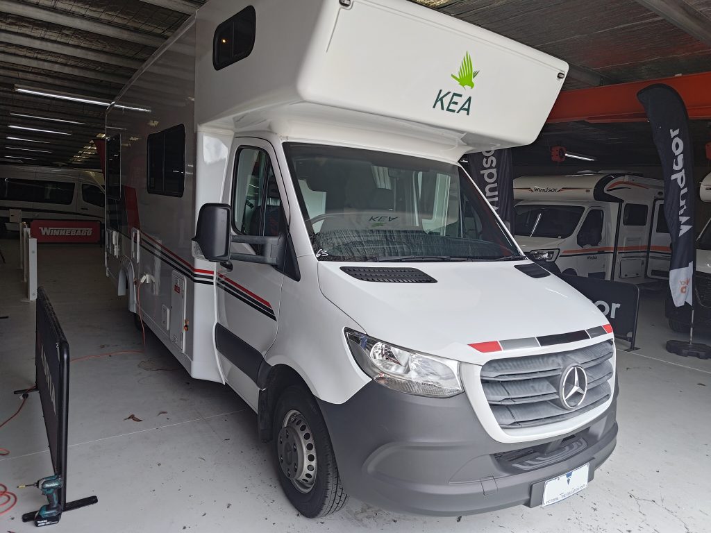 Front view of the Mercedes Sprinter KEA motorhome before modifications, photographed inside the dealership showroom.
