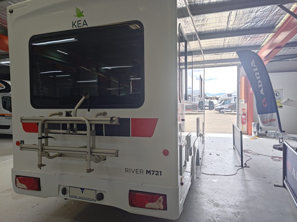 Rear view of the Mercedes Sprinter KEA motorhome before conversion, highlighting the factory rear layout and storage rack.
