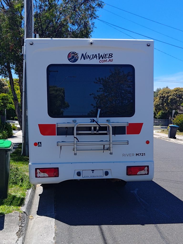 Rear view of the Mercedes Sprinter KEA motorhome after the NinjaWeb wrap, showing updated branding and visual identity.